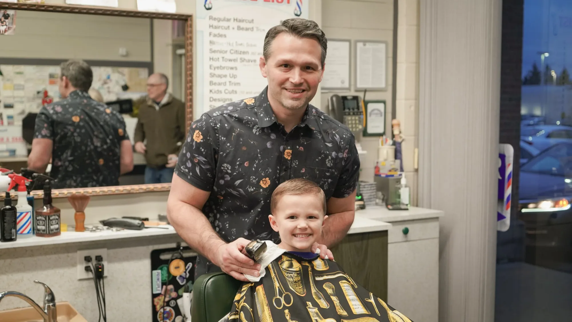 Young client smiling after a kids' haircut at Ledgewood Barber Shop, Strongsville