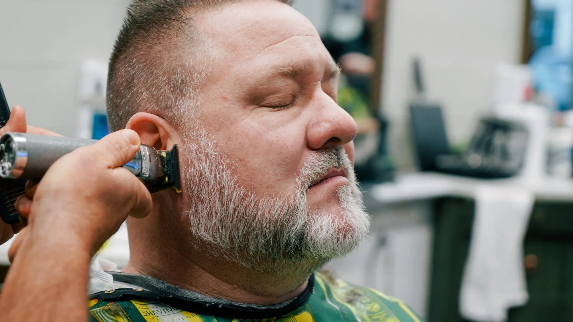 Clipper cut and neckline trim on an older client at Ledgewood Barber Shop, Strongsville