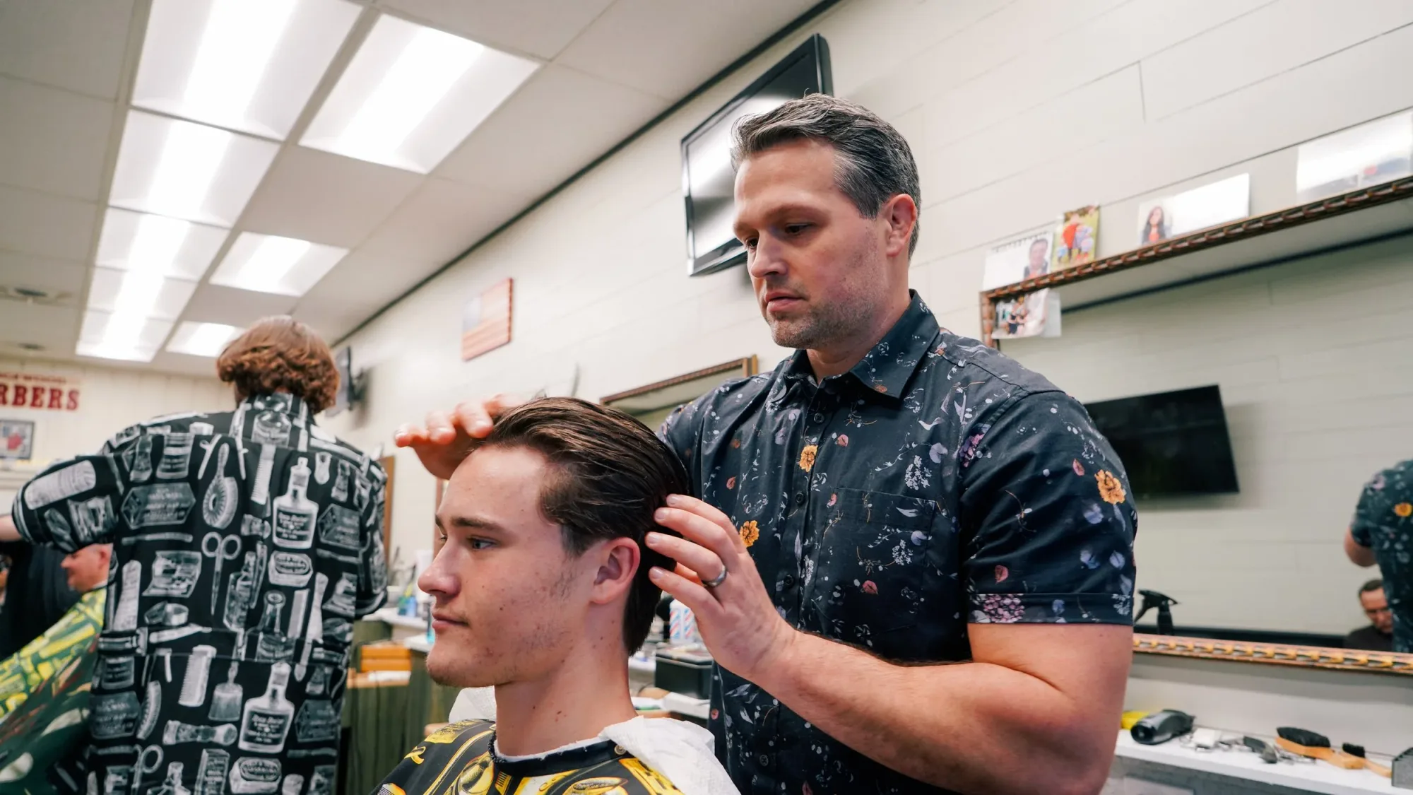 Brushed-back men's haircut finish at Ledgewood Barber Shop